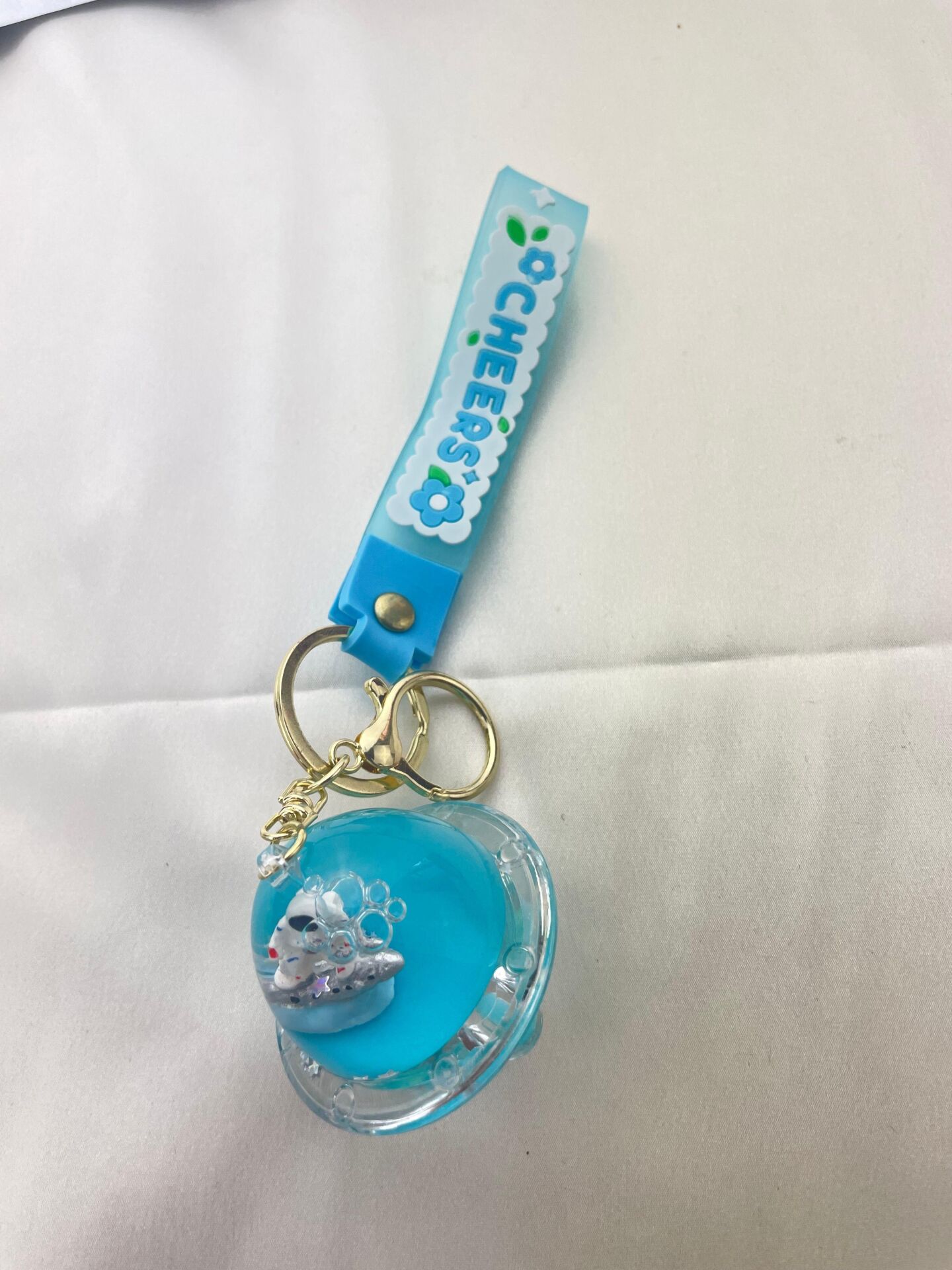 Schlüsselanhänger mit Wasserfigur